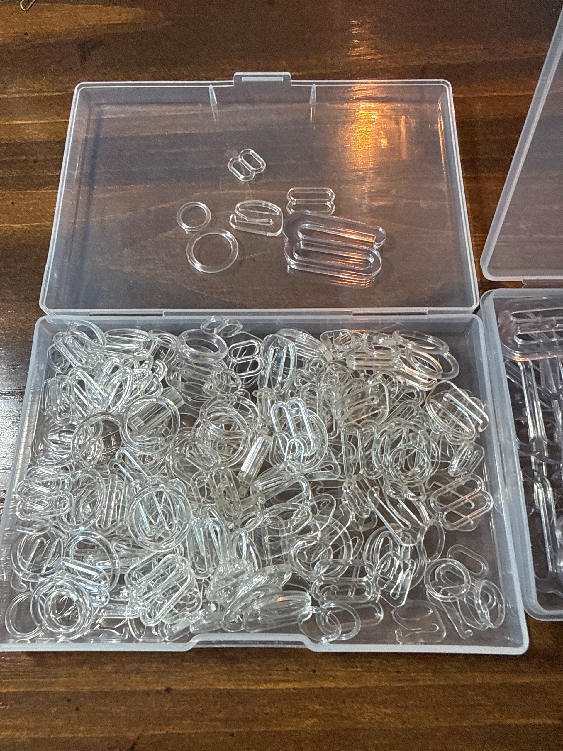 Swimsuit enclosures and strap findings